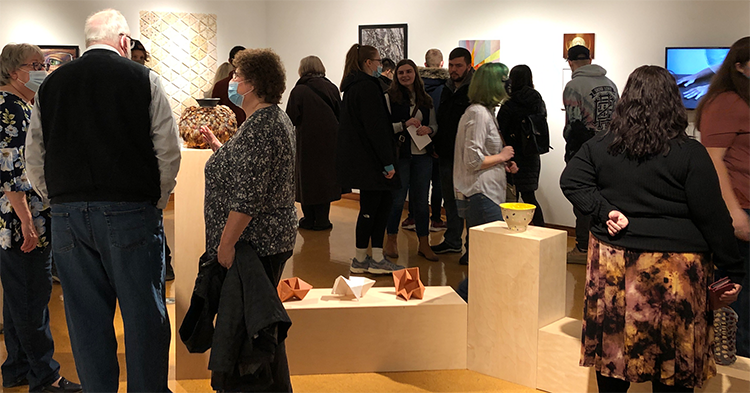 Patrons attending the 2022 UToledo Juried Student Exhibition opening reception