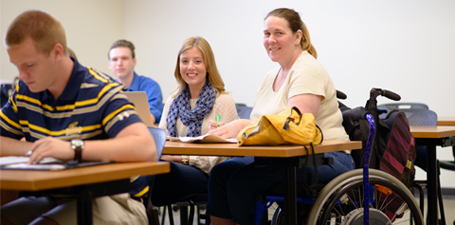 Student in a wheelchair sitting in class 