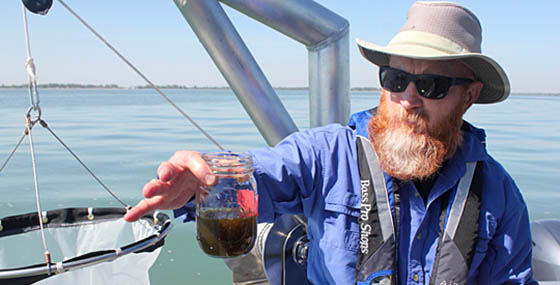 Tom Bridgeman showing a Lake Erie water sample