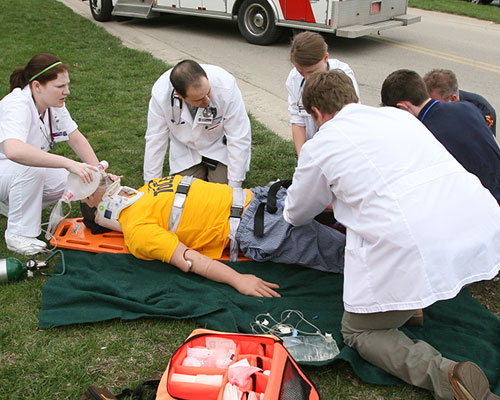Students participating in a mock crash simulation