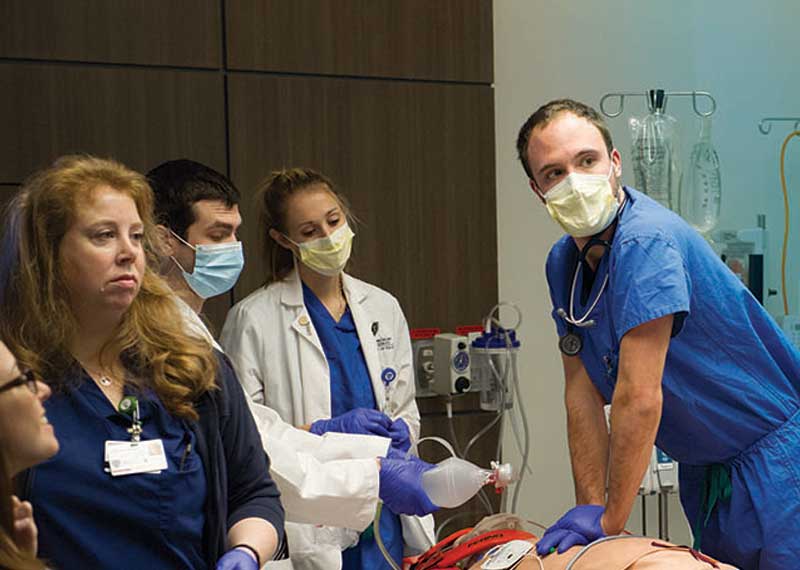 Medical students simulating a medical crisis