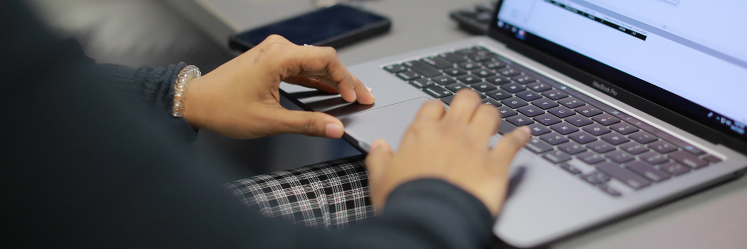 a person typing on a laptop