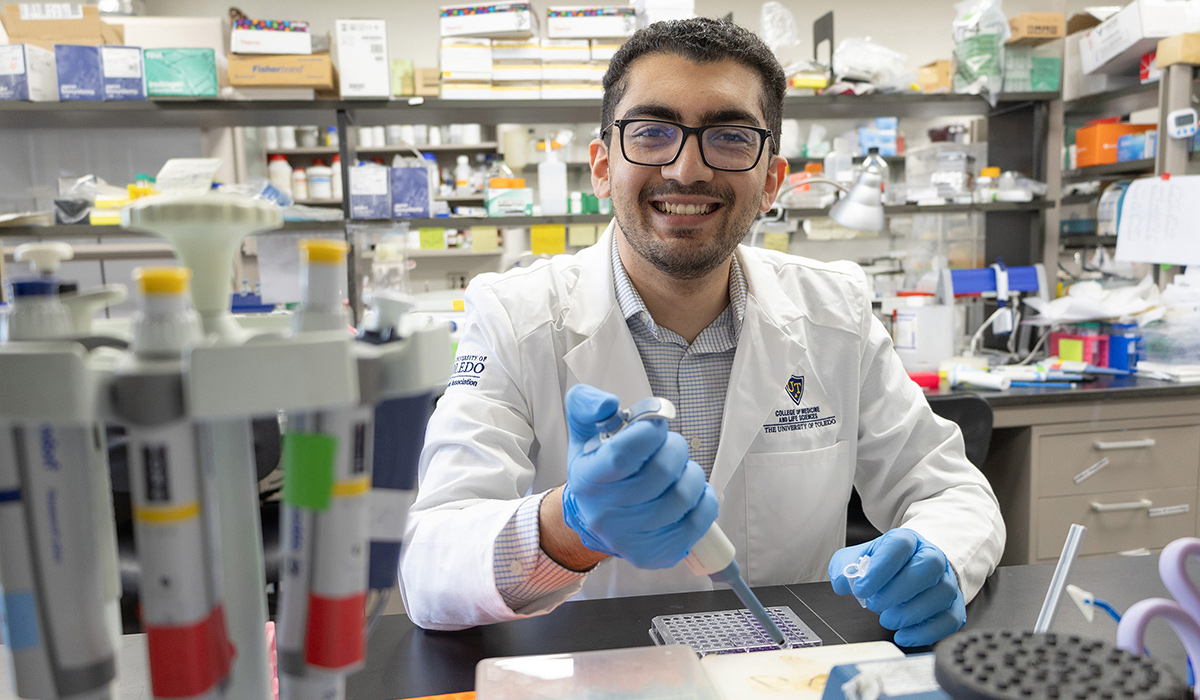 M.D./Ph.D. student Ahmad Hegazi works at his bench in the laboratory of Dr. Kuo-Hui Su in the Department of Cell and Cancer Biology on Health Science Campus.