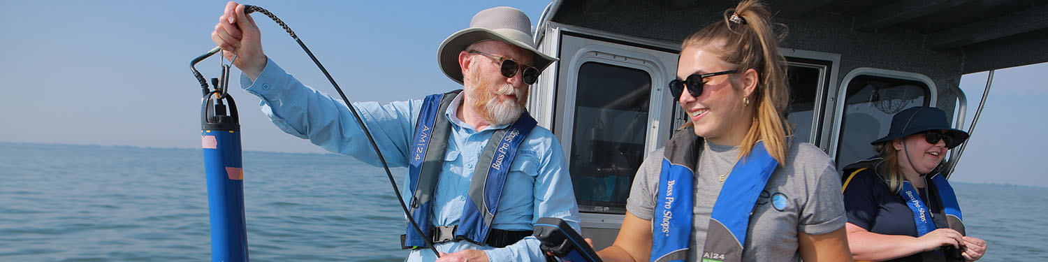 Dr. Bridgeman on research boat with students